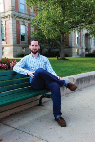 Indianapolis Adoption Lawyer Bryan D. Stoffel sitting on park bench in Indianapolis